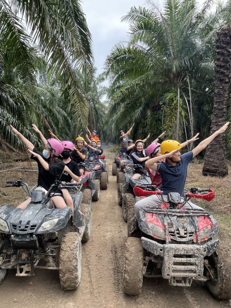 Team outing at Gamuda Gardens Luge with colorful helmets